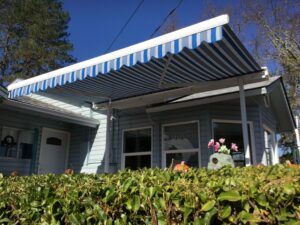 Retractable patio cover installed by professionals over a home’s porch